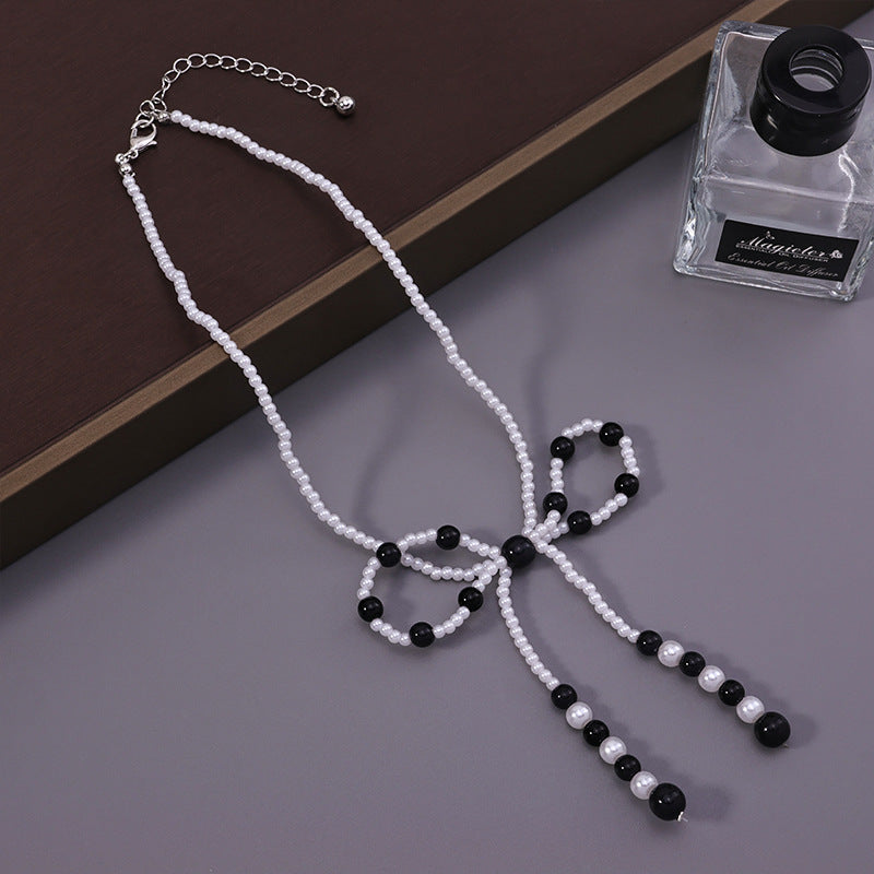 Faux Pearl Bow Necklace – Black/White