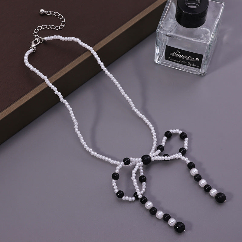 Faux Pearl Bow Necklace – Black/White
