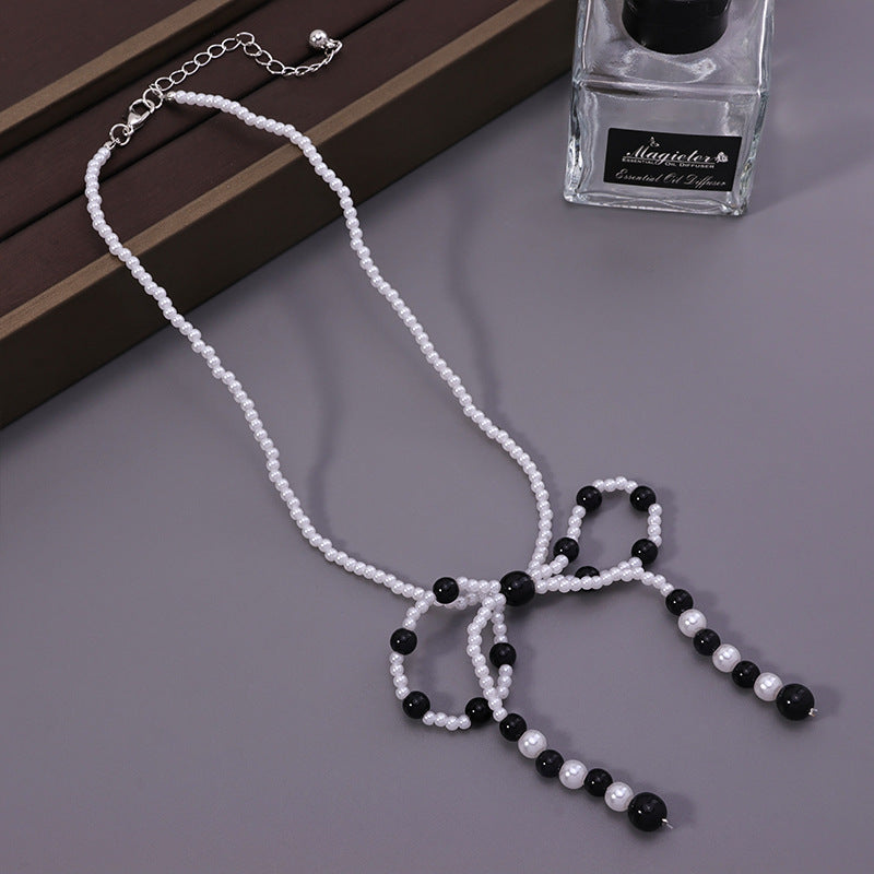 Faux Pearl Bow Necklace – Black/White