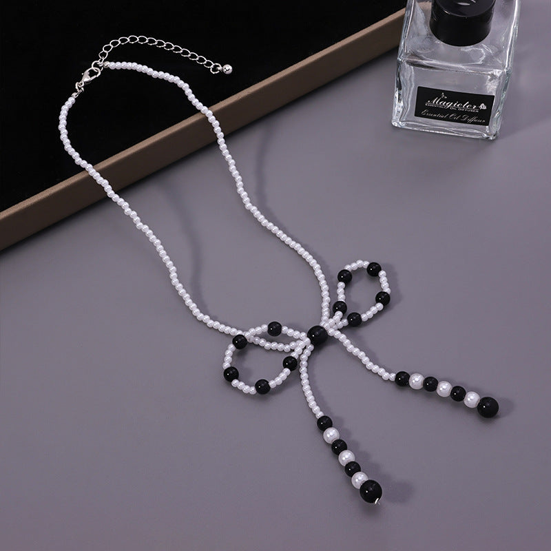 Faux Pearl Bow Necklace – Black/White